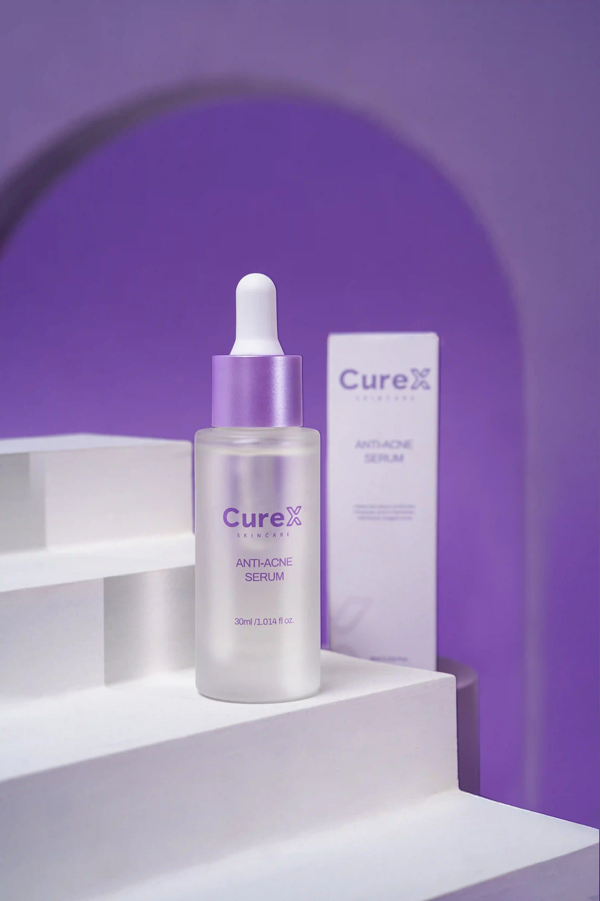 CureX anti-acne serum bottle and packaging on a white platform with a purple background
