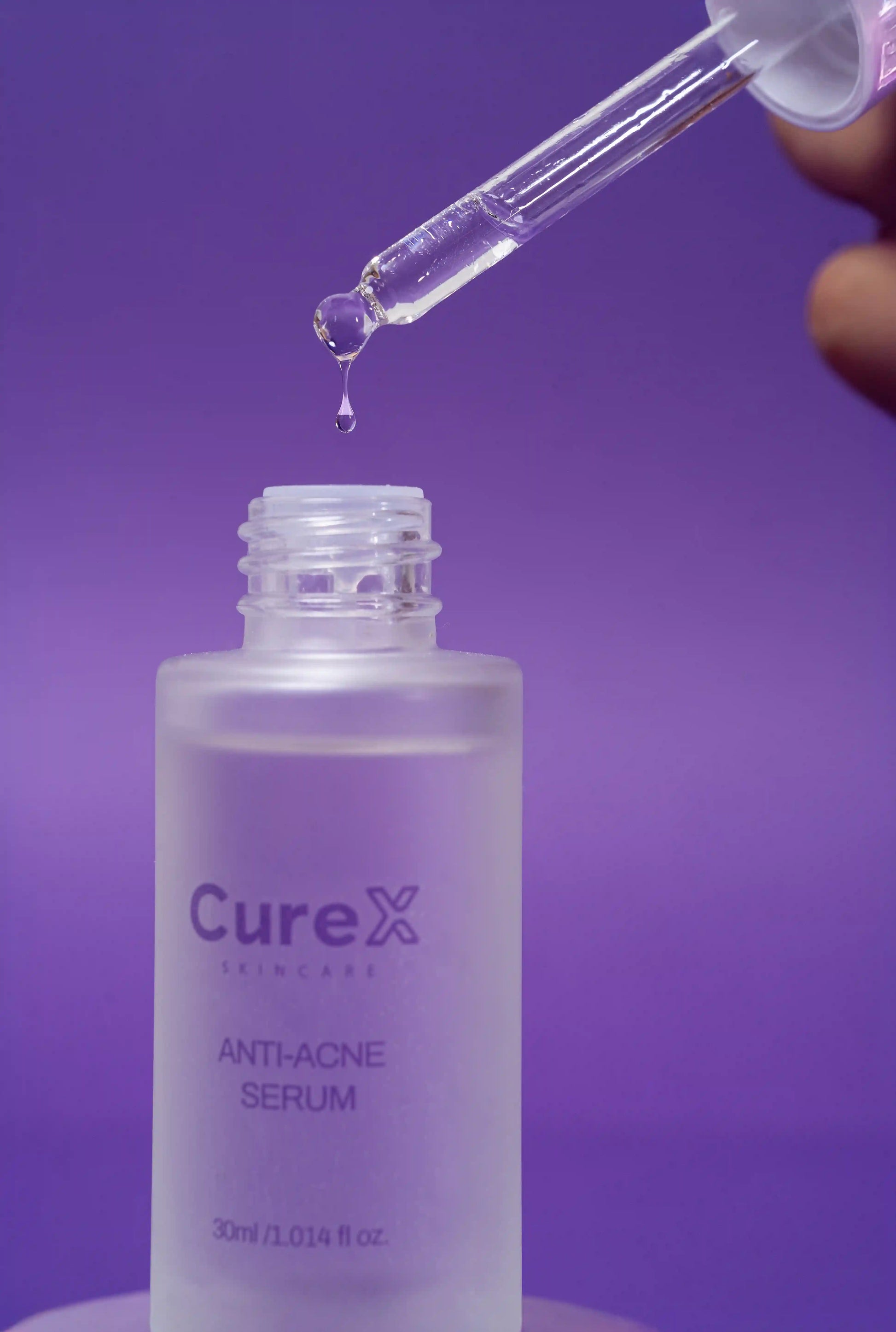 Curex anti-acne serum bottle with dropper on a purple background