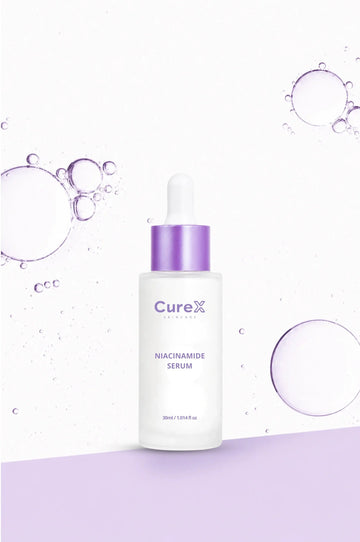 CureX niacinamide serum bottle with bubbles on a light purple background