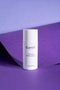 CureX oil-free moisturizer bottle on a purple background