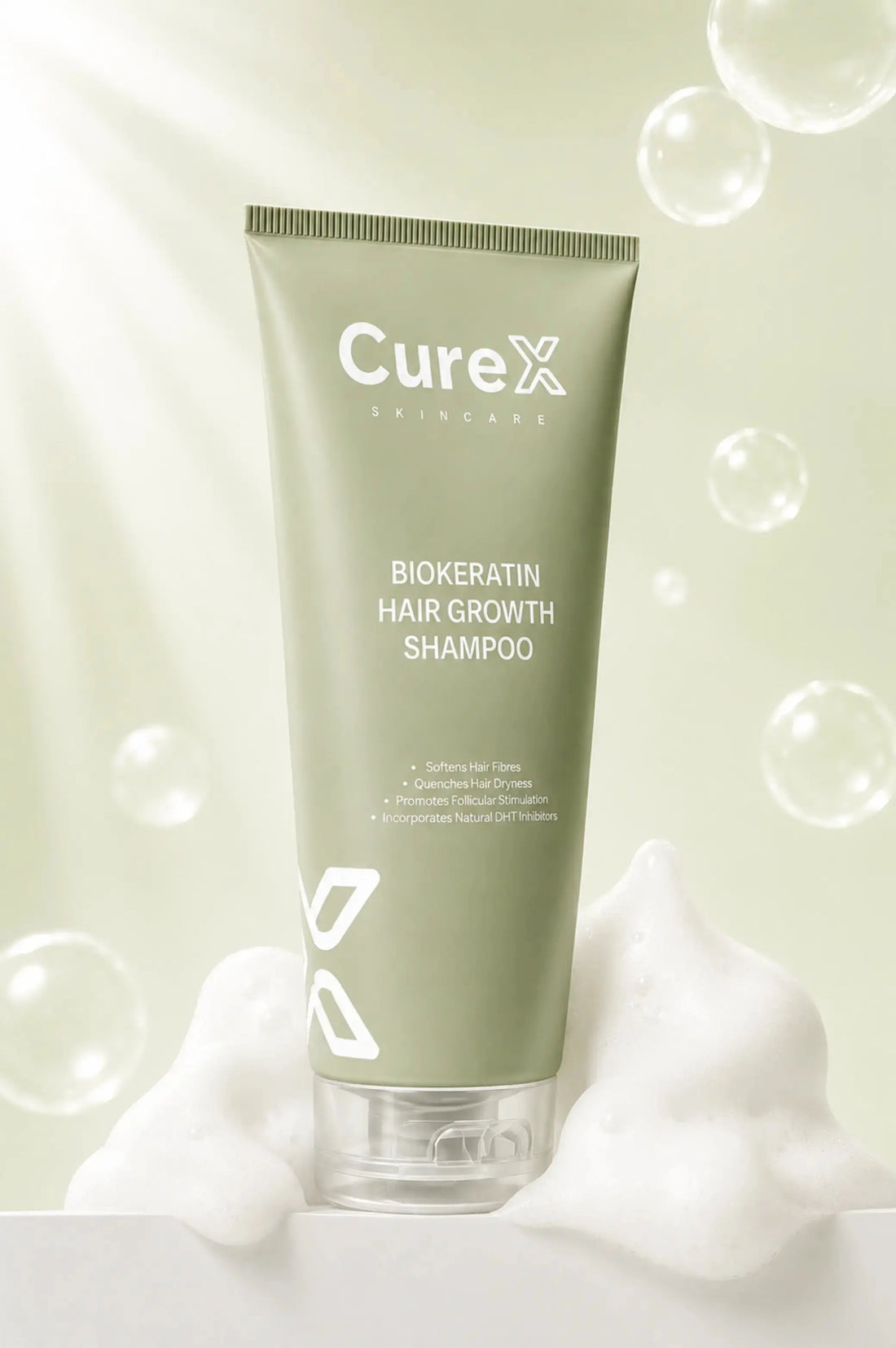 Curex Biokeratin Hair Growth Shampoo tube with bubbles on a light green background
