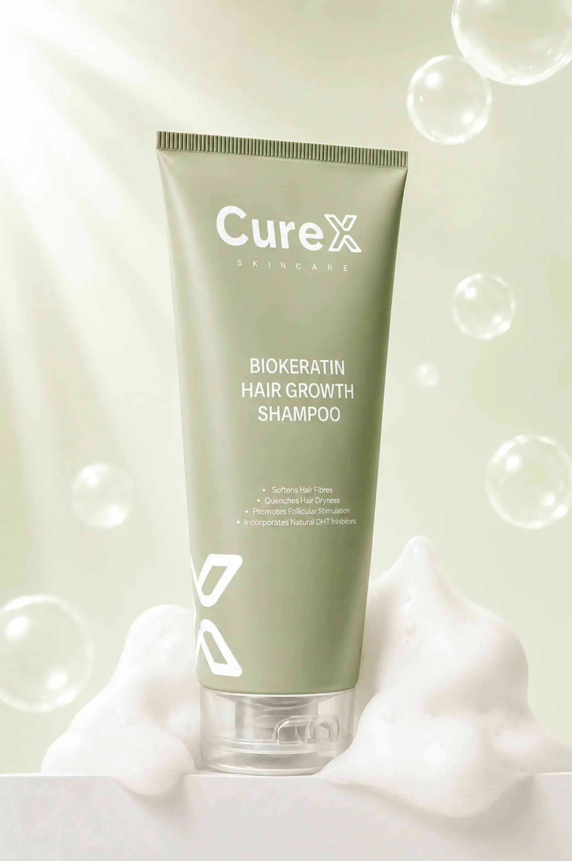 Curex Biokeratin Hair Growth Shampoo tube with bubbles on a light green background